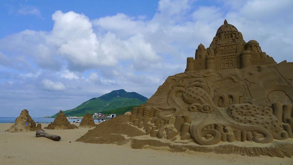 Large, detailed sand sculptures on Fulong Beach