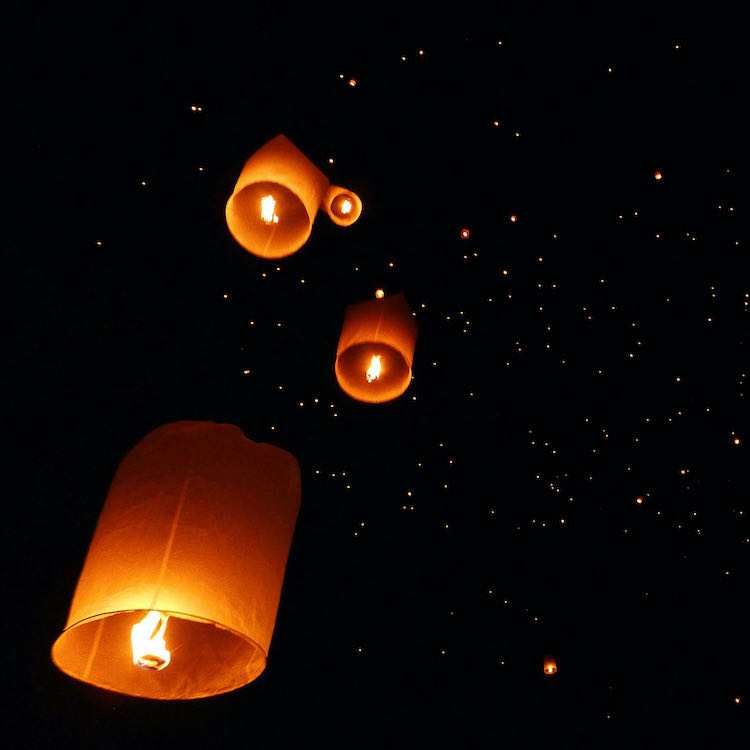Sky lanterns float away during the Yi Peng festival.
