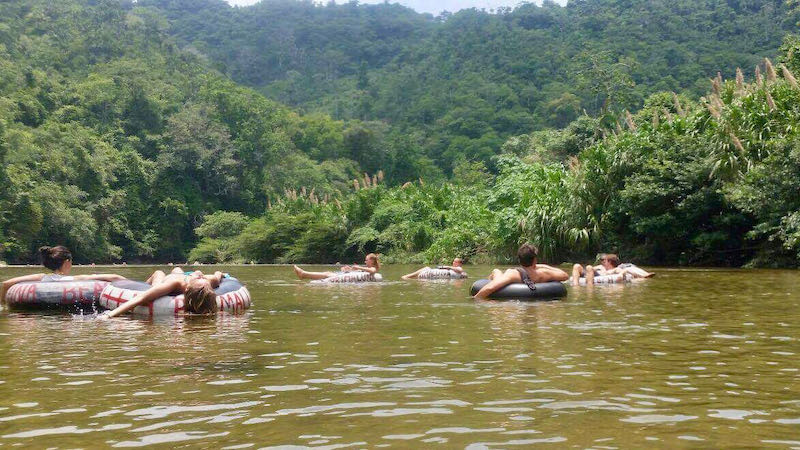 People float in inner tubes along the Palomino River.
