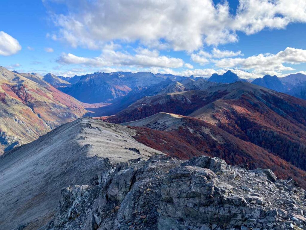 Looking out at Cerro Tronador from the summit of Cerro Bellavista, with late autumn colors carpeting the surrounding mountains. This is one of my favorite hikes in Bariloche.