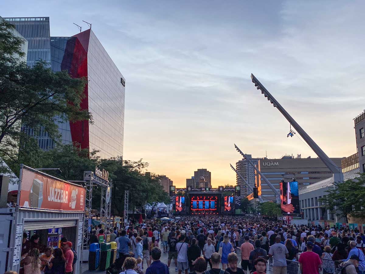A large crowd in front of the main stage at Montreal Jazz Fest in the Quartier des Spectacles.