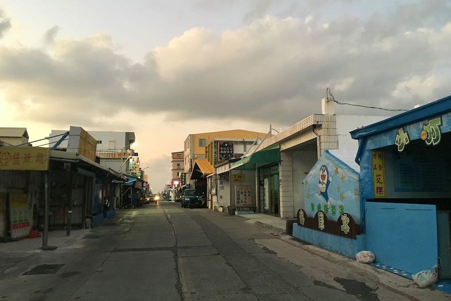 The main road in Nanliao village in low season with one car and zero people.