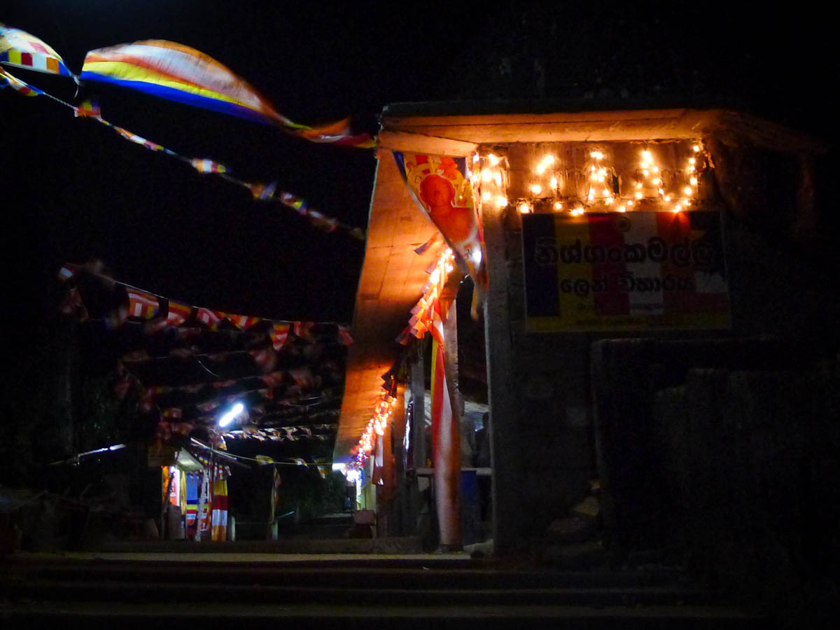 Lights and prayer flags decorate the path to Adam's Peak/Sri Pada at night.