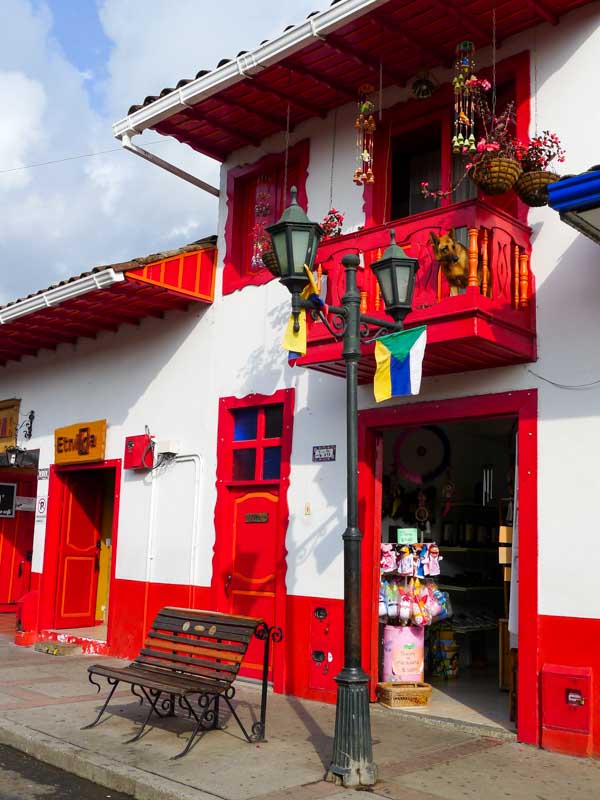 Bright red accents on a white building in Salento, a small town in Colombia's coffee region and the gateway to the Cocora Vally.
