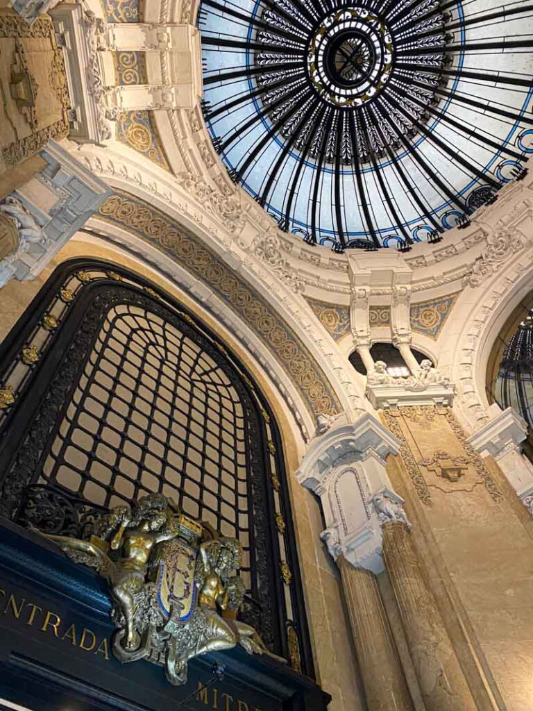 Looking up at the domed blue ceiling of the Art Nouveau interior of Galería Güemes on Calle Florida.