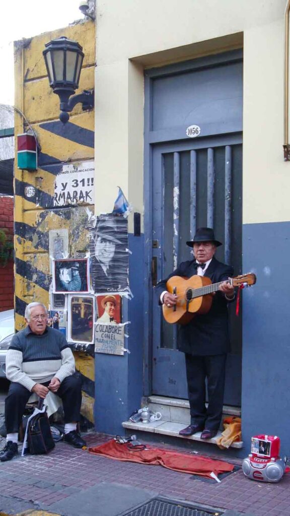 A Carlos Gardel imitator sings and plays guitar at the Sunday San Telmo Fair in Buenos Aires.
