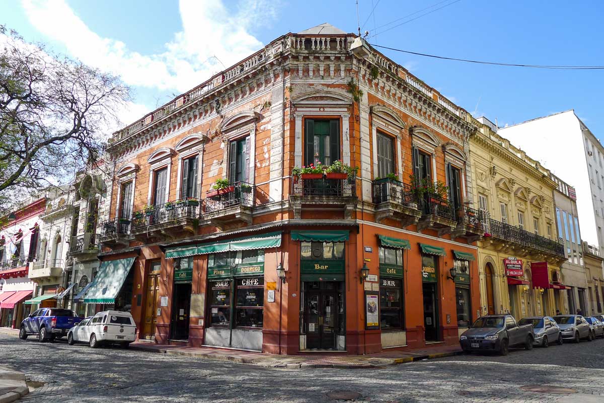 Charming old facade of Bar Plaza Dorrego on a cobblestone street corner in San Telmo, Buenos Aires.