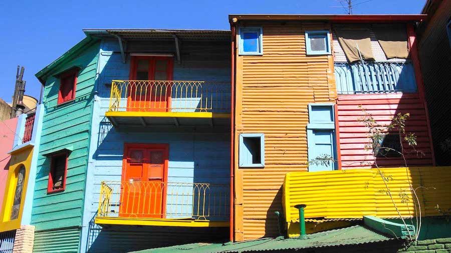 Colorful, brightly painted facades of the Caminito street in La Boca, a must-see stop on any Buenos Aires itinerary.