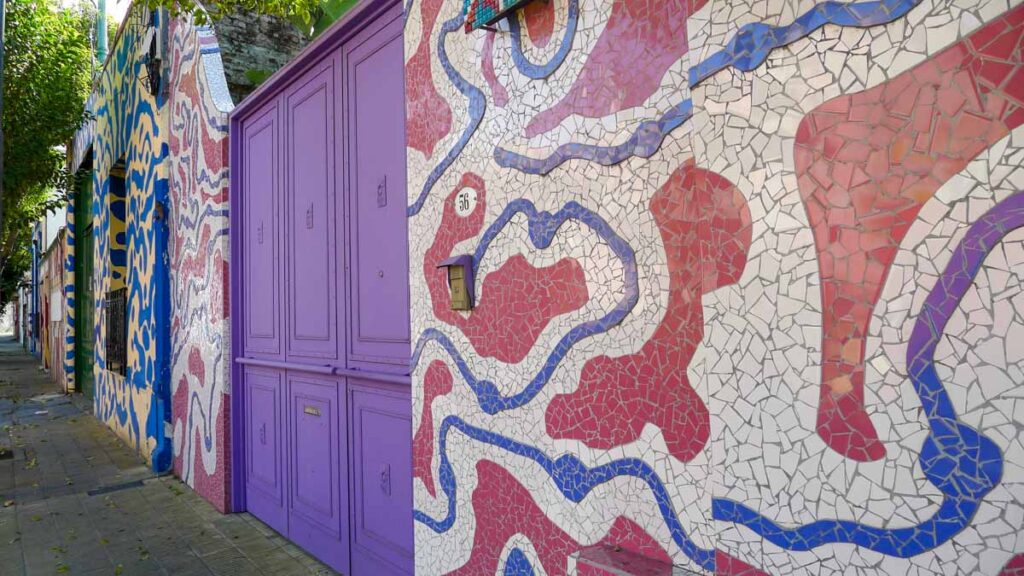 Colorful mosaic tiles next to a purple door on Calle Lanín in Buenos Aires.