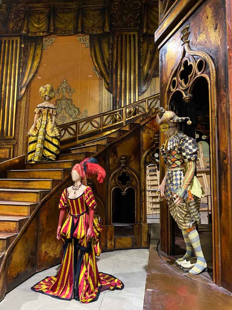A gold staircase and ornate costumes from the Tales of Hoffmann opera on display at the Colón Fábrica museum in La Boca.