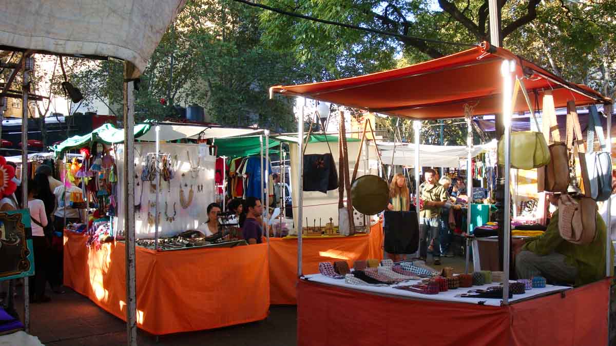 Jewelry, leather goods, and other handicrafts on display at the Plaza Serrano weekend market.