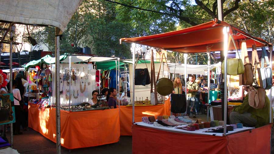 Jewelry, leather goods, and other handicrafts on display at the Plaza Serrano weekend market.