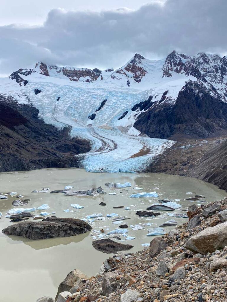 View of Torre Glacier, with big chunks of ice floating in the lake below, from Mirador Maestri.