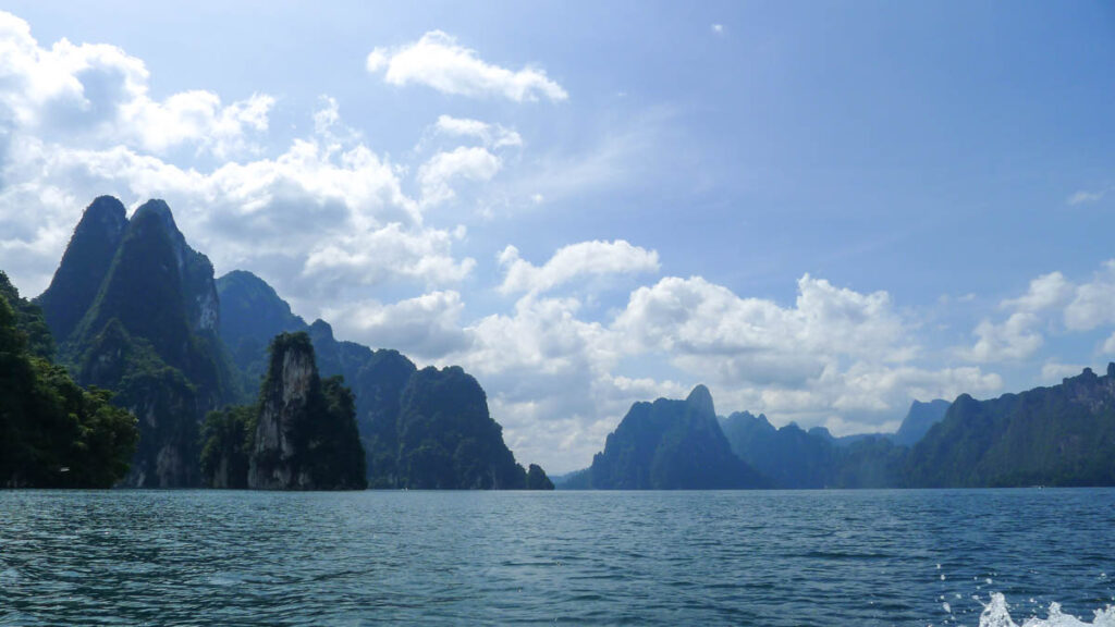 Dramatic limestone cliffs jutting out of Khao Sok lake, the most unique destination on this 3-week Thailand itinerary.