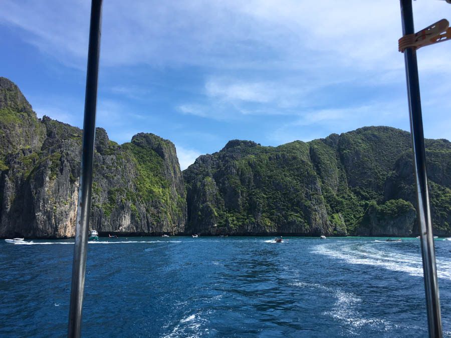 Boats and limestone cliffs at Koh Phi Phi Leh viewed from a Koh Lanta dive boat heading to Koh Bida.