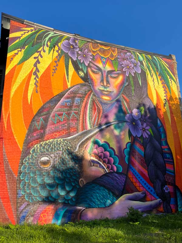 Impressive and colorful mural depicting mother and baby by artist Shalak Attack in the Plateau.