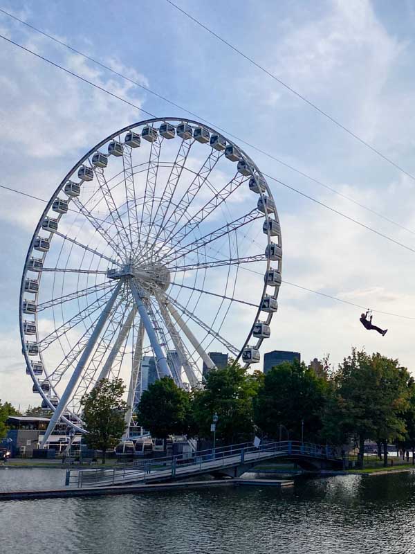 Ziplining over Bonsecours Basin next to La Grande Roue in Montreal's Old Port neighborhood.