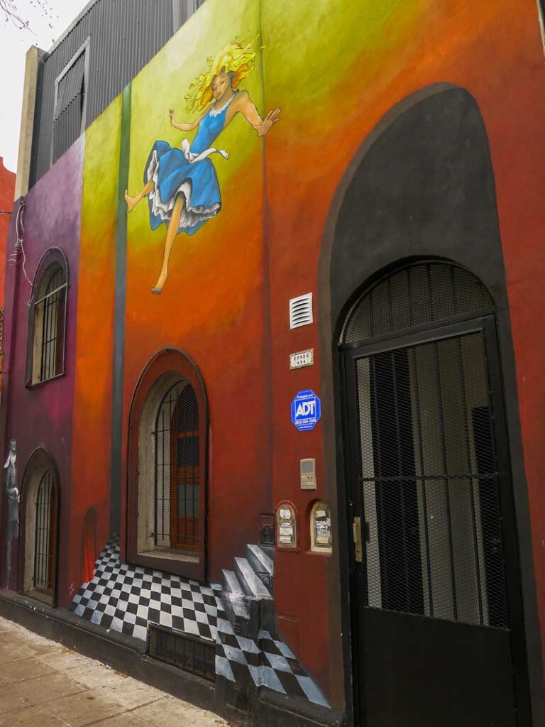 Celine Hitier's Alice in Wonderland mural in Colegiales, a non-touristy neighborhood of Buenos Aires.