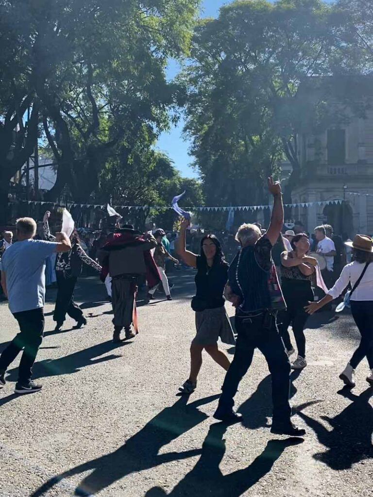 Buenos Aires locals perform a traditional dance with scarves at the Feria de Mataderos.