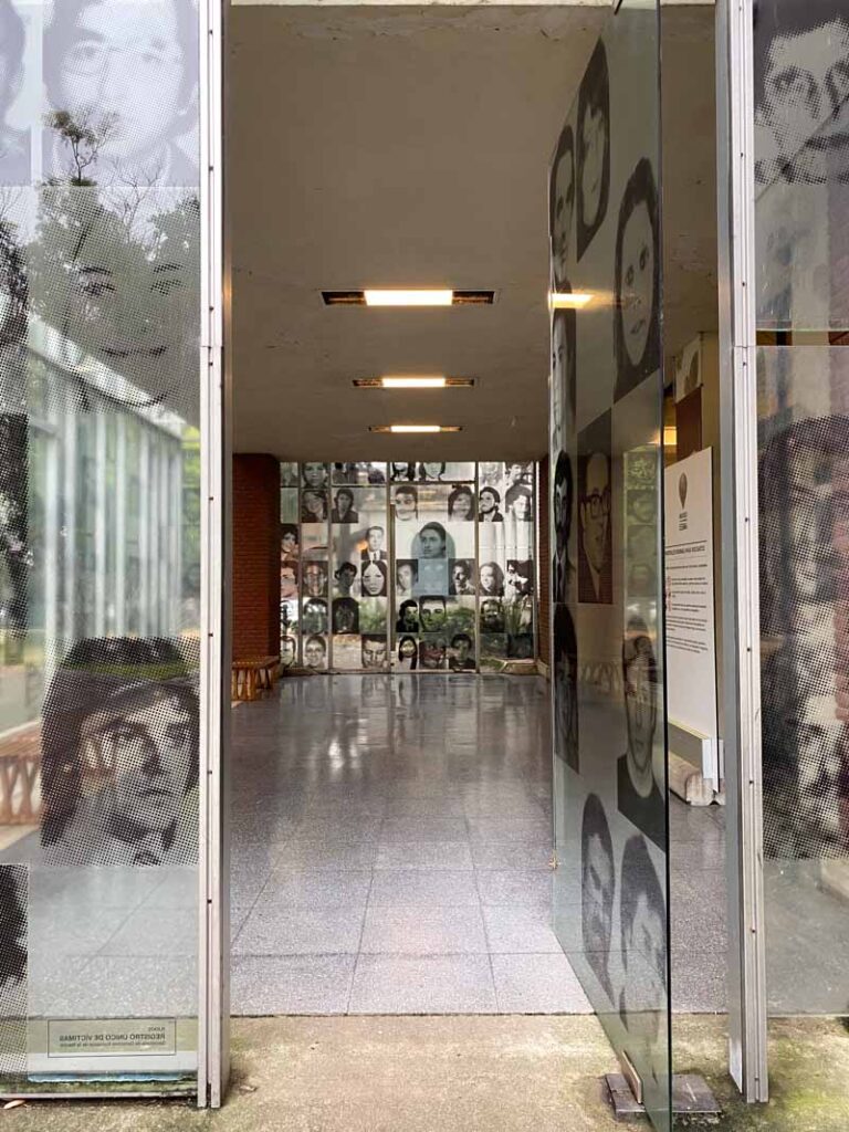 Faces of Dirty War victims displayed on the glass of the ESMA museum entrance in Núñez.