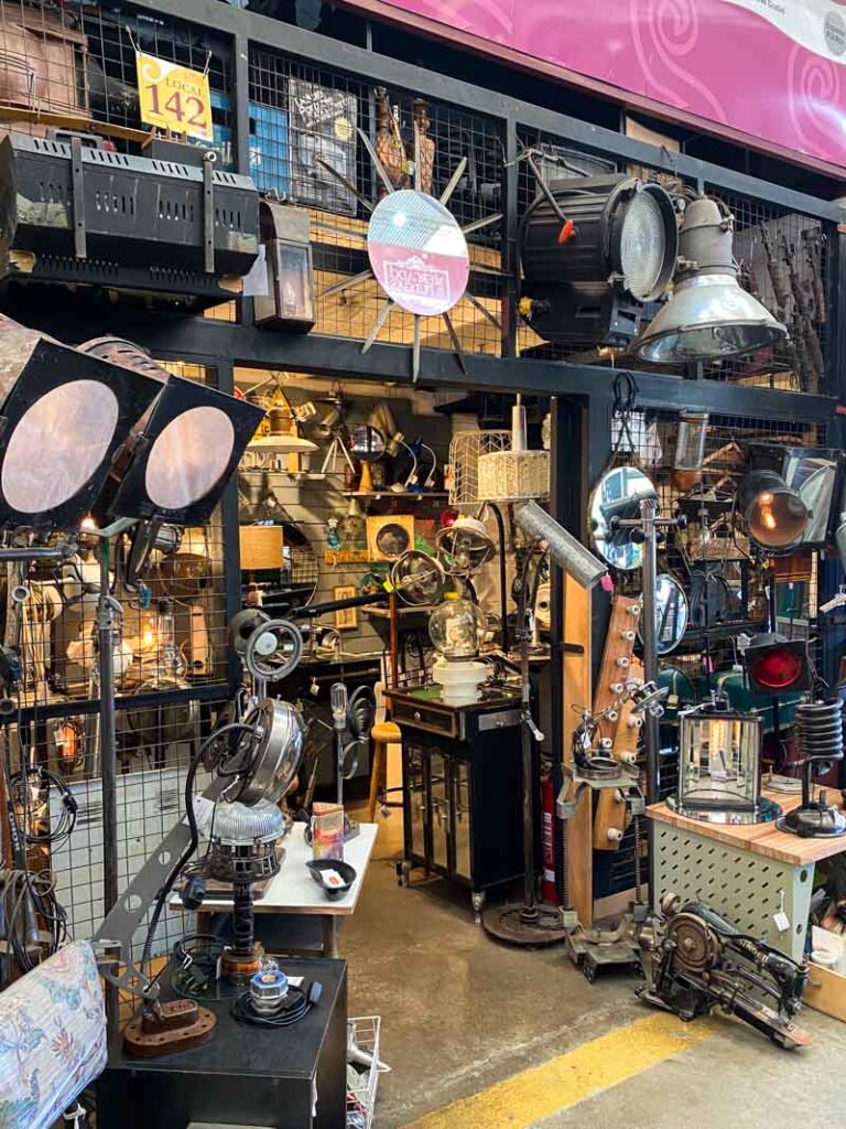 Stage lights and other light fixtures for sale at a flea market stall in Buenos Aires.