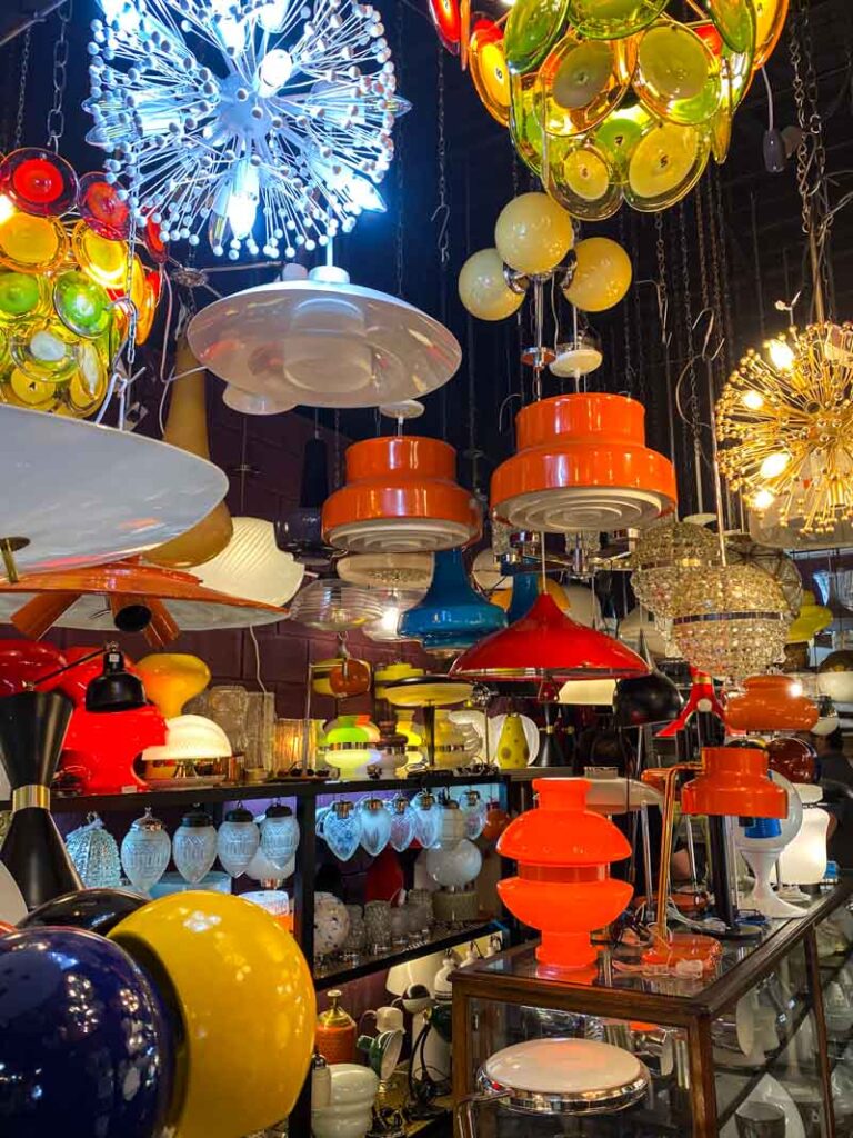 A variety of colorful retro-style lamps for sale at the Mercado de las Pulgas.