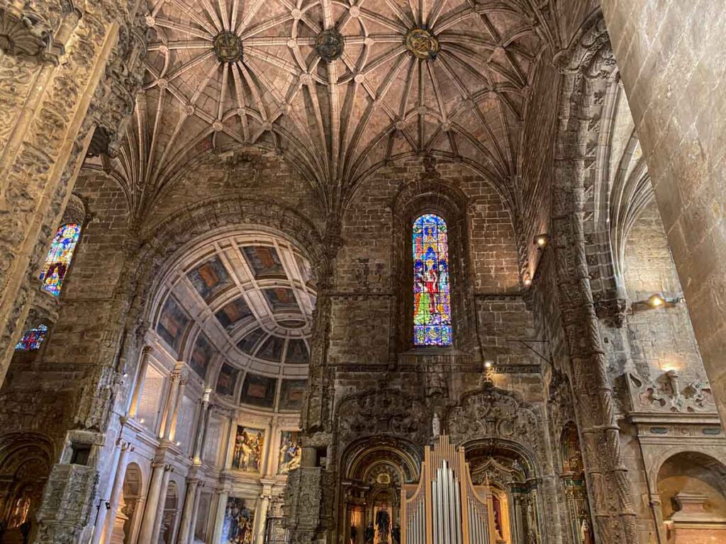 The interior of Santa Maria de Belém Church, the burial place of Vasco da Gama, with beautiful vaulted ceiling and stained glass.
