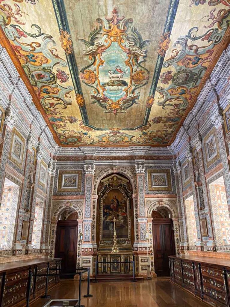 Sacristy at São Vicente de Fora church, with a beautifully painted ceiling and intricate decoration all over the walls.